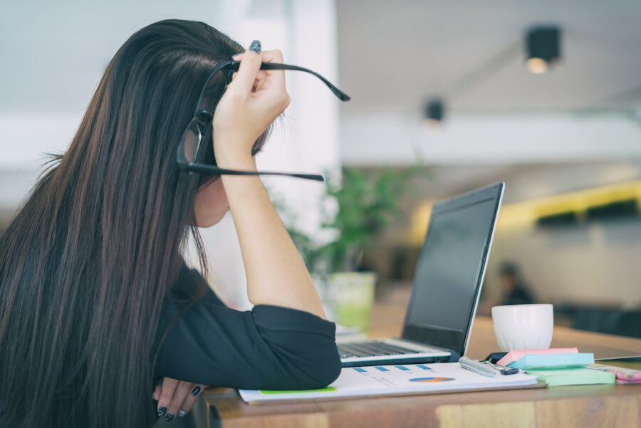 Modern Business Woman At Workplace Tired And Worried In Office